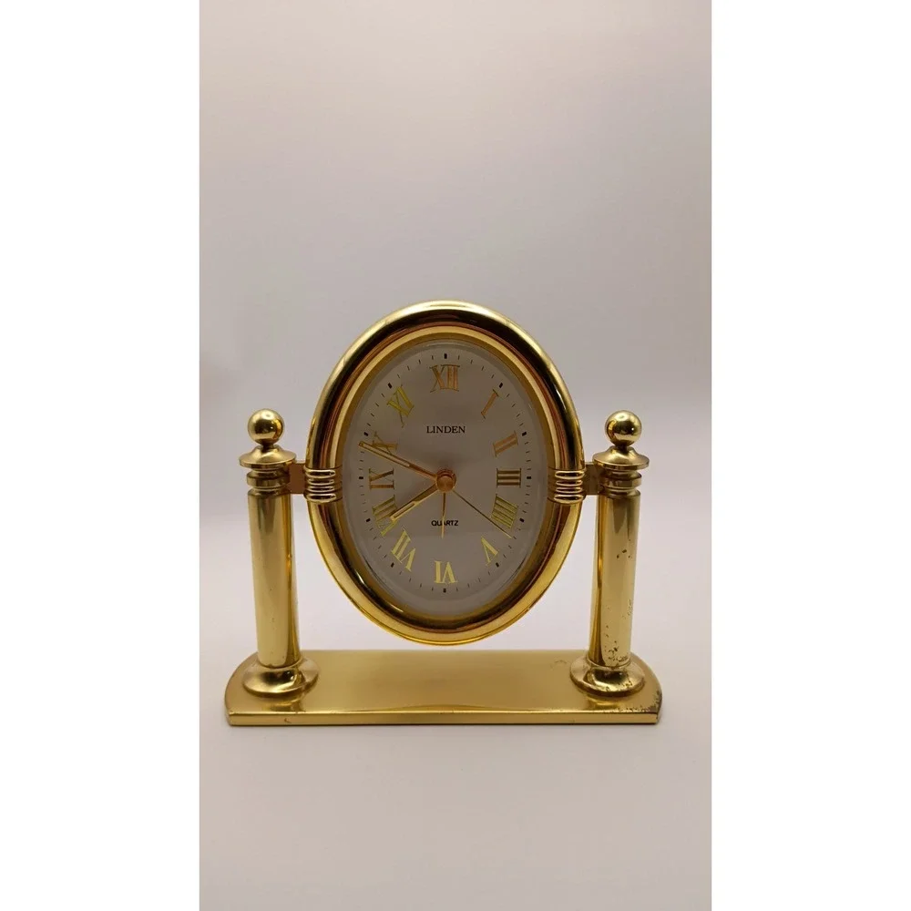 Linden Quartz Oval Desk Clock Gold Tone Swivel Pillar Mantle Timepiece
